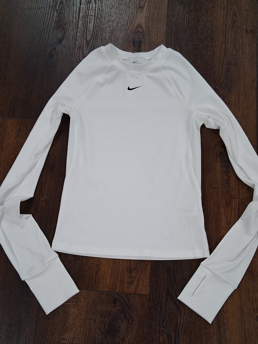 Nike White Long Sleeve Women's Athletic Top with Black Swoosh